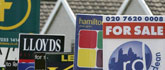 Boards in East London advertising property for sale and rent 